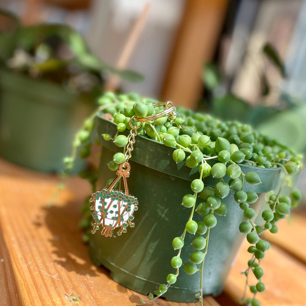 Gleaming String of Pearls Enamel Keychain Unisex