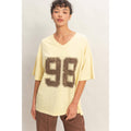 Oversized Varsity Style V-Neck Graphic T-Shirt