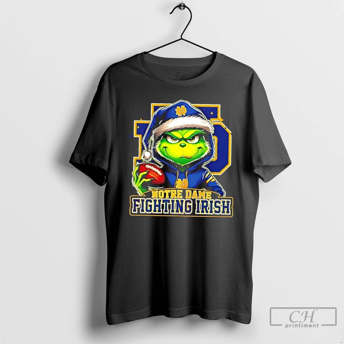 Premium Grinch Is Holding A Ball And Smiling At Notre Dame Fighting Irish Fans Christmas Unisex
