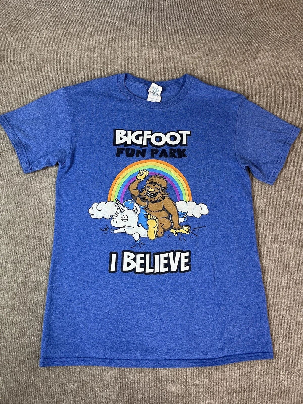 Adult S T Shirt Bigfoot Fun Park Rainbow Unicorn Believe Fantasy Blue Travel Unisex