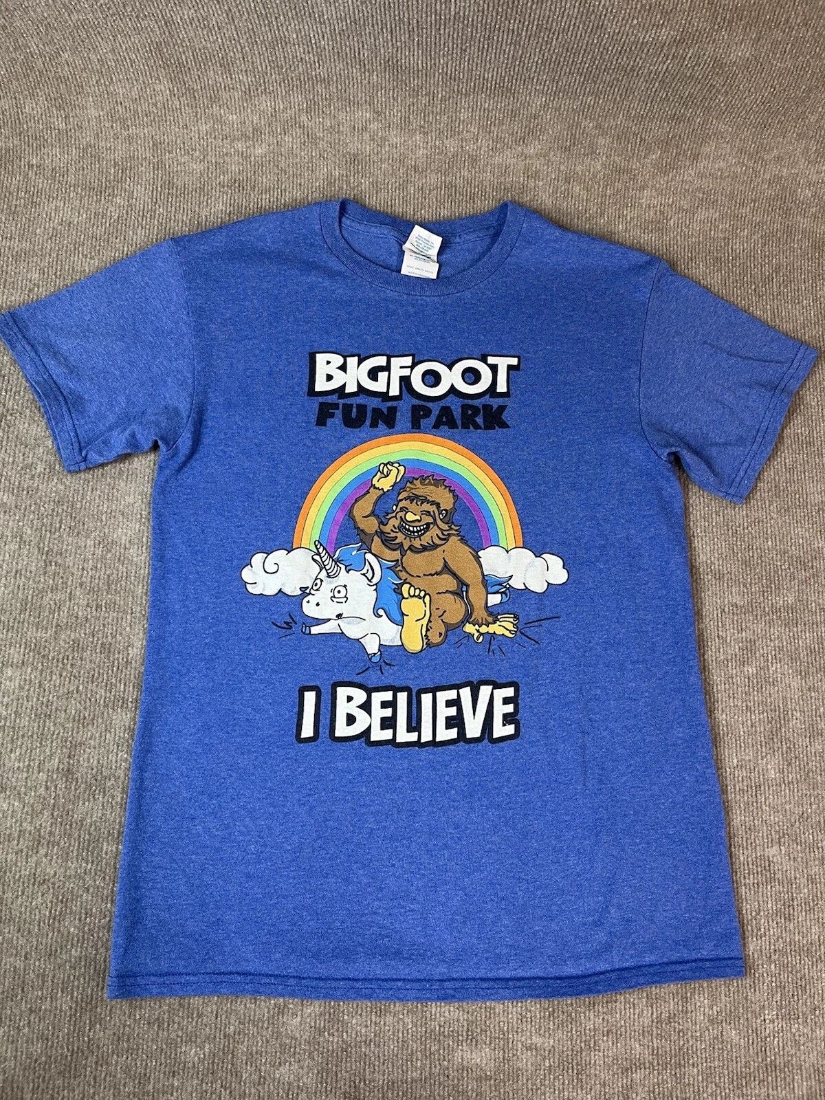 Adult S T Shirt Bigfoot Fun Park Rainbow Unicorn Believe Fantasy Blue Travel Unisex